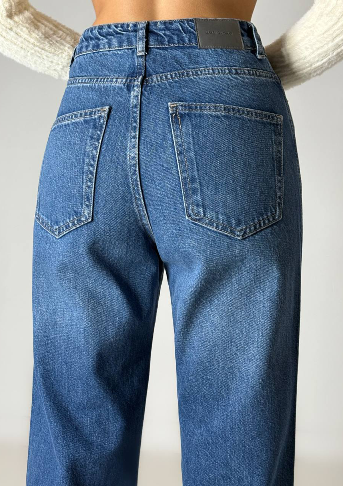 Kara Straight Jean — close up back view showing five-pocket detail and contrast stitching in medium blue wash | Mia & Luna