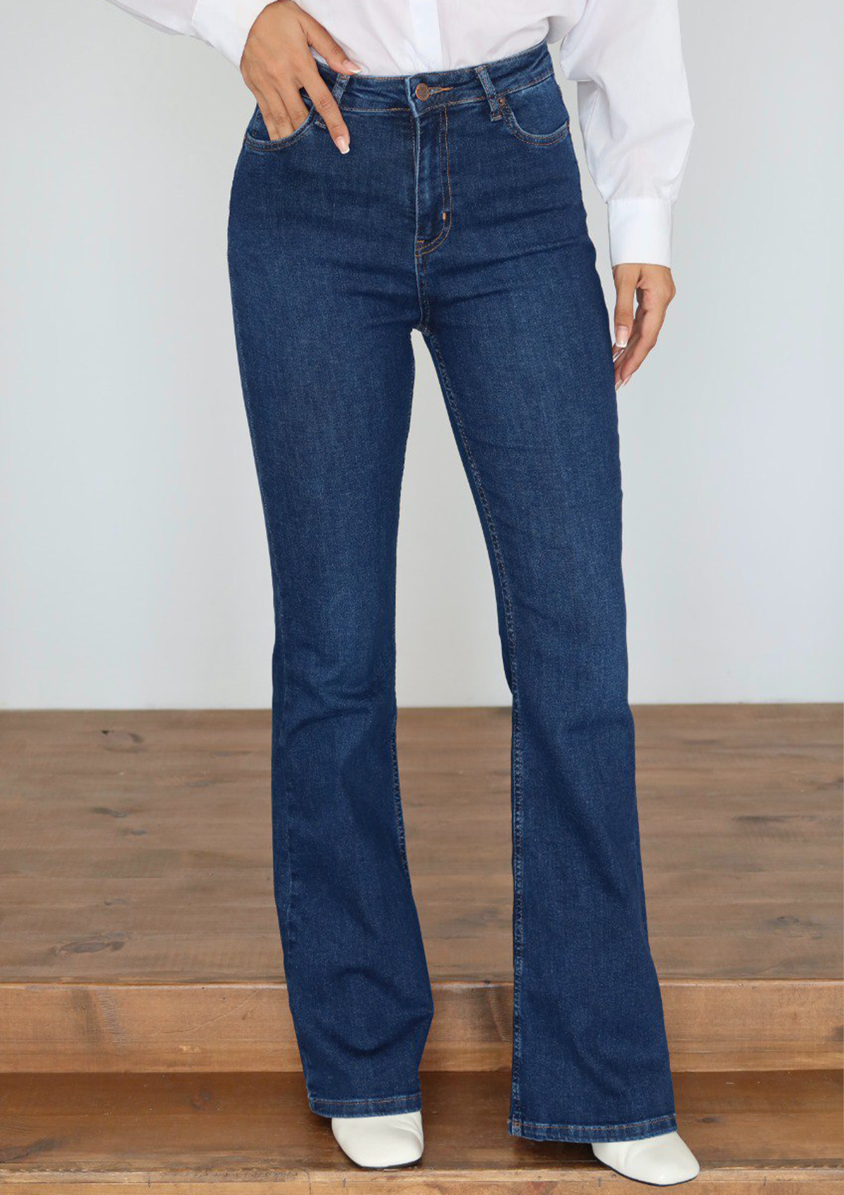 Lara Dark Blue Flare Jean — half body front view showing high-rise waist and five-pocket detail in dark blue wash | Mia & Luna