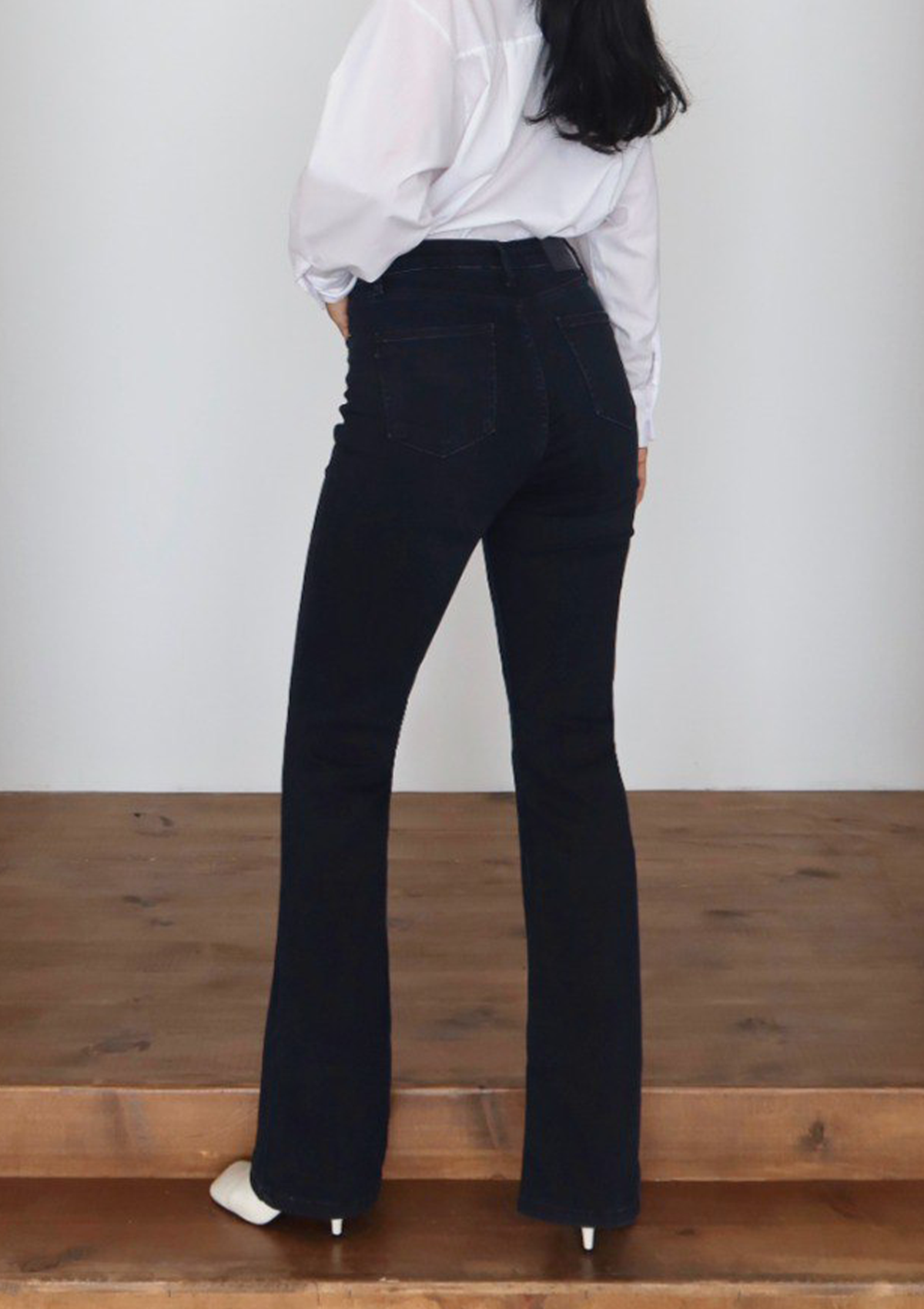 Lara Deep Indigo Flare Jean — full body back view showing full flare hem and back pocket detail in deep indigo wash | Mia & Luna
