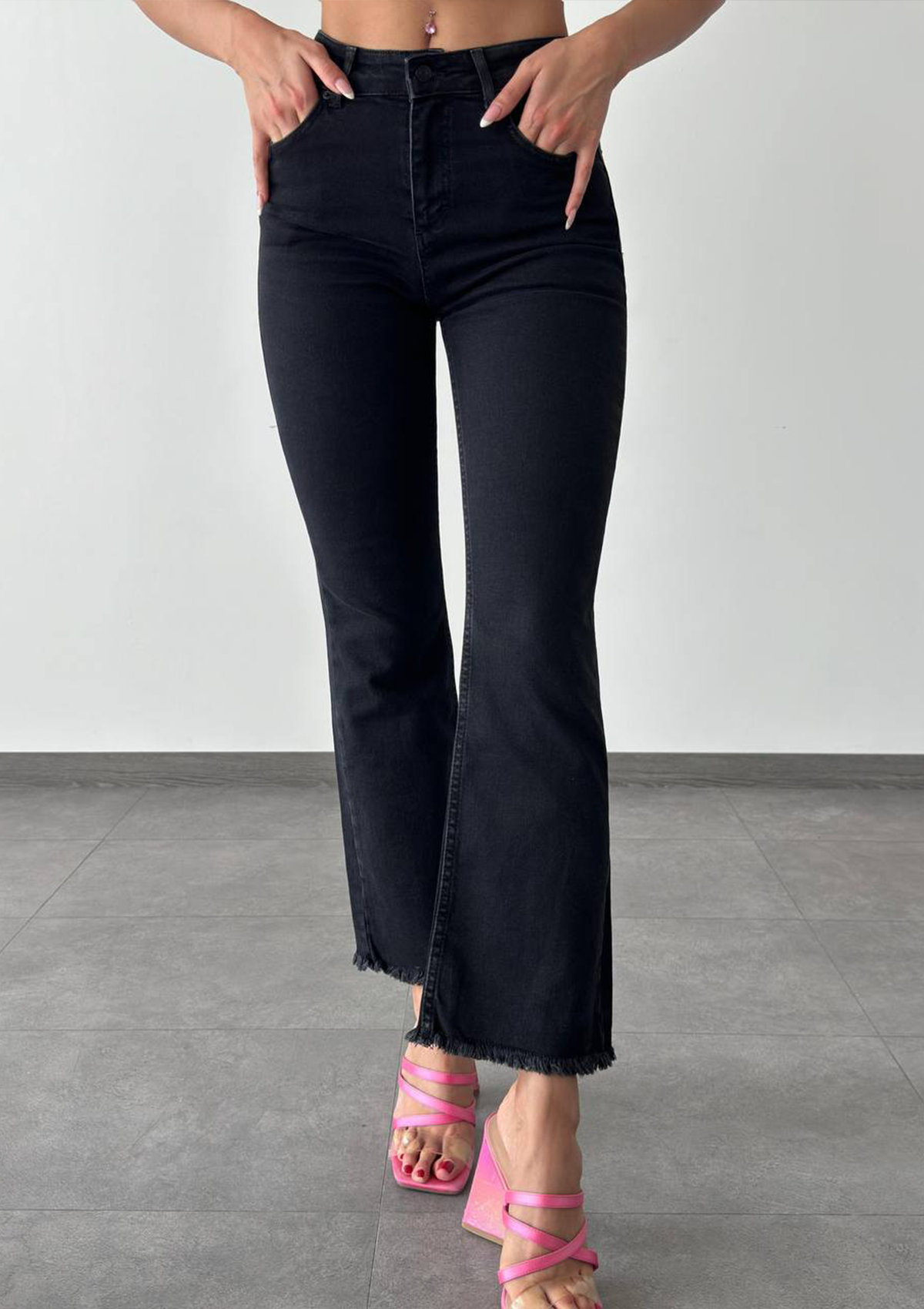 Aria Black Mini Flare Jean — half body front view showcasing high-rise waist and mini flare silhouette in deep black wash | Mia & Luna