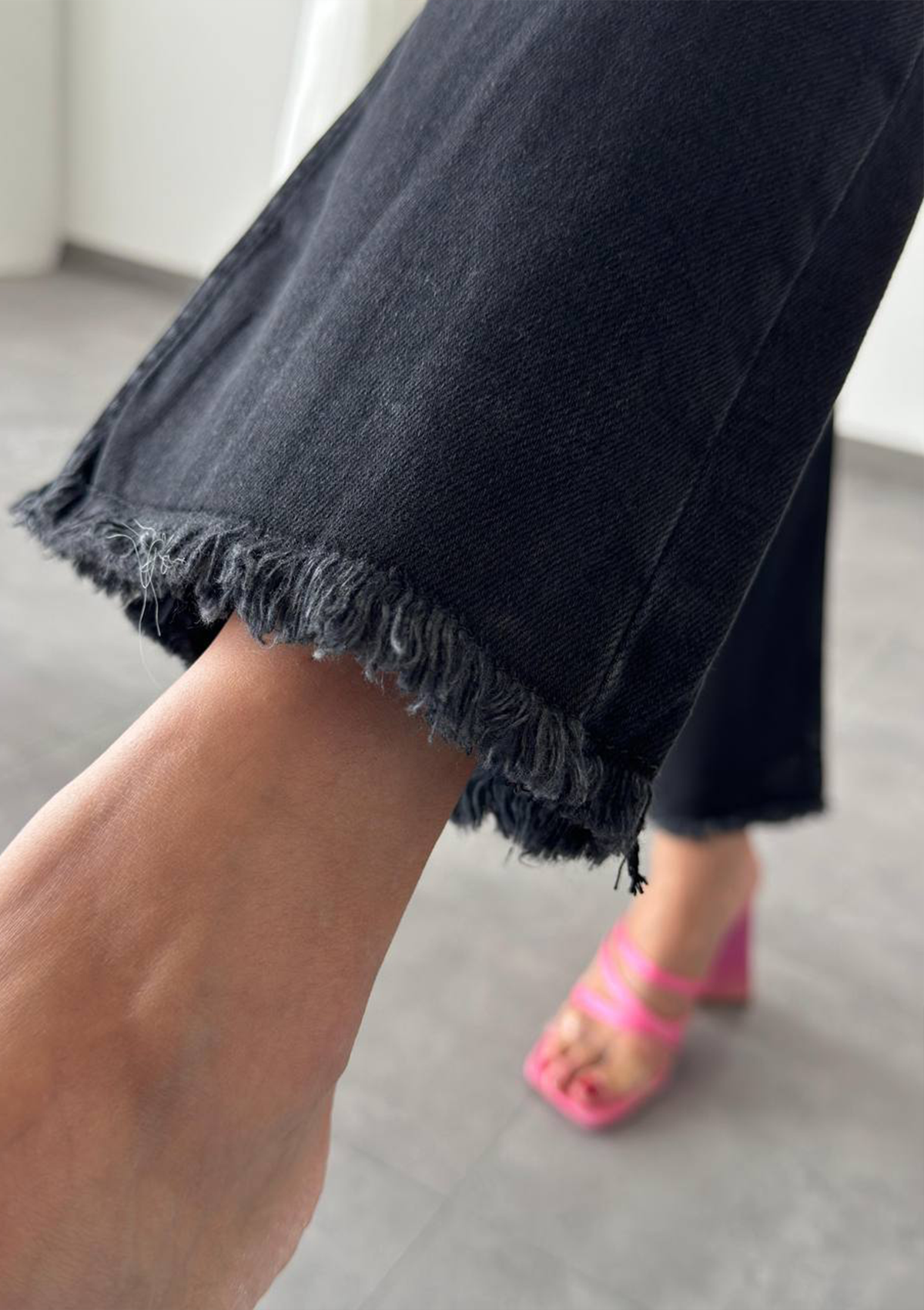 Aria Black Mini Flare Jean — close up of fray hem detail at the mini flare opening in deep black wash | Mia & Luna