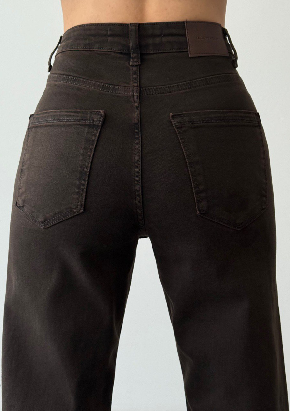 Nita Espresso Straight Jean — close up detail of back pockets, belt loops and contrast stitching in espresso wash | Mia & Luna