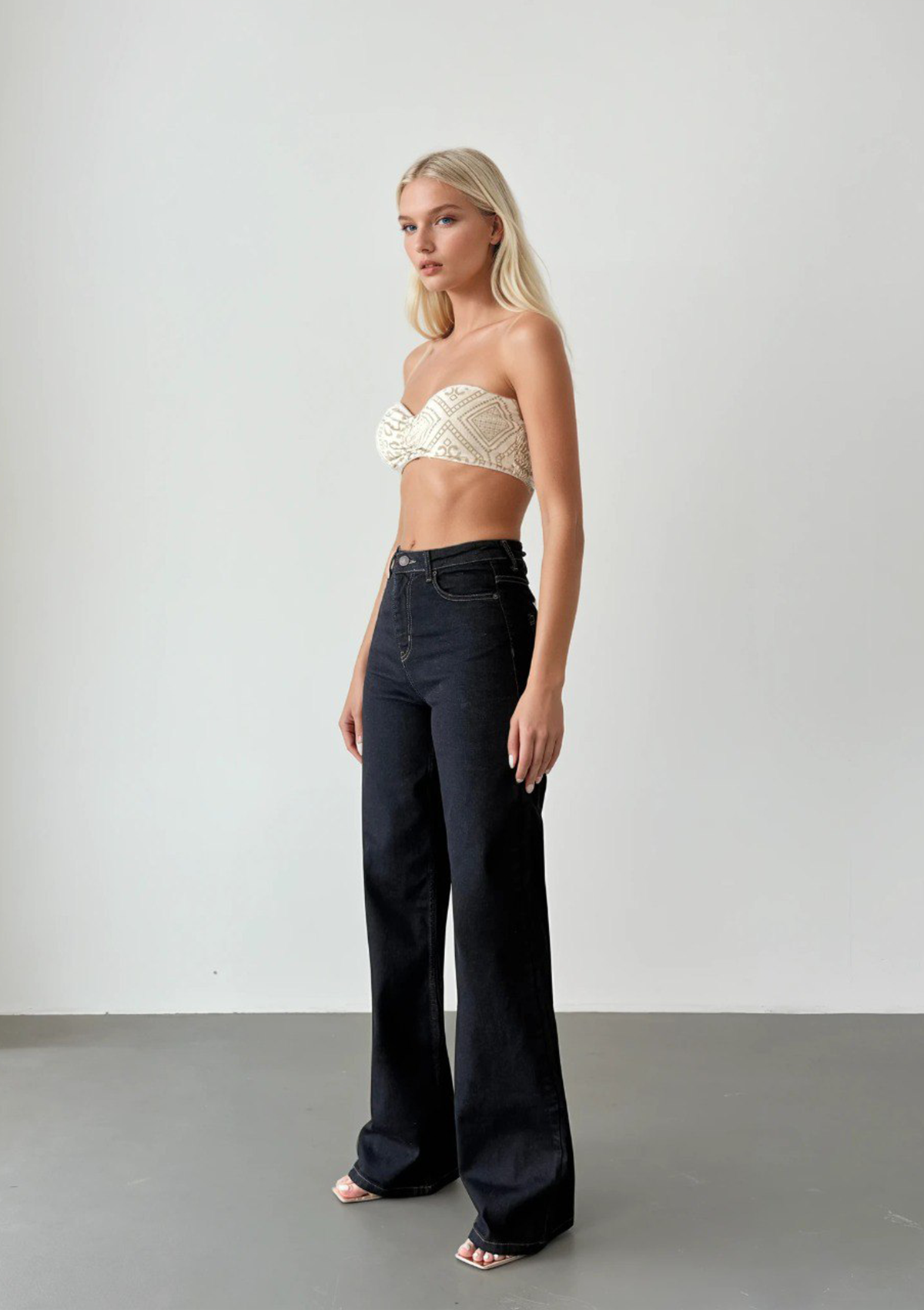 Nita Dark Rinse Straight Jean — full body styled view of model in a slight side profile stance, highlighting straight leg cut and deep rinse wash | Mia & Luna